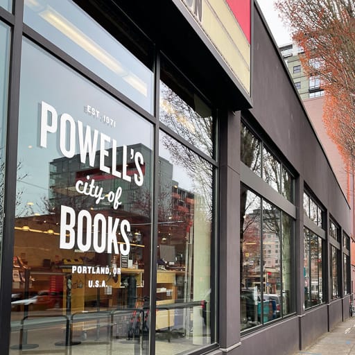 A window of a bookstore that says powell's city of books